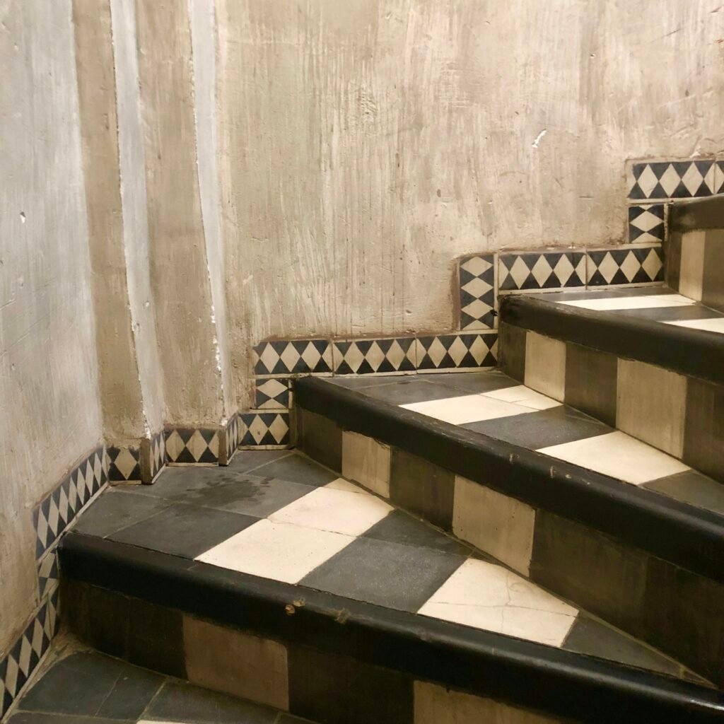 Real tile and architectural photography used as editorial inspiration. Not a photograph or approved color sample of Diamond in Pearl Grey.